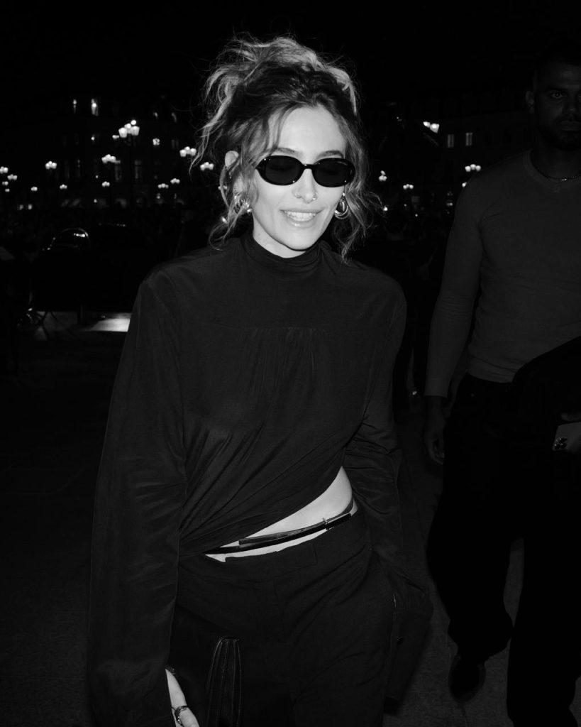 Fashionable attendee in sophisticated tailoring
