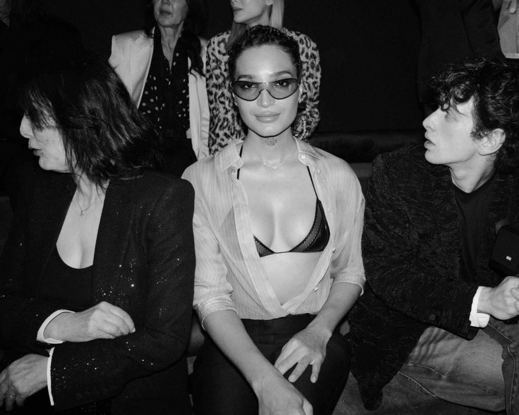 Attendee embodying Tom Ford's sophisticated aesthetic at the Paris presentation
