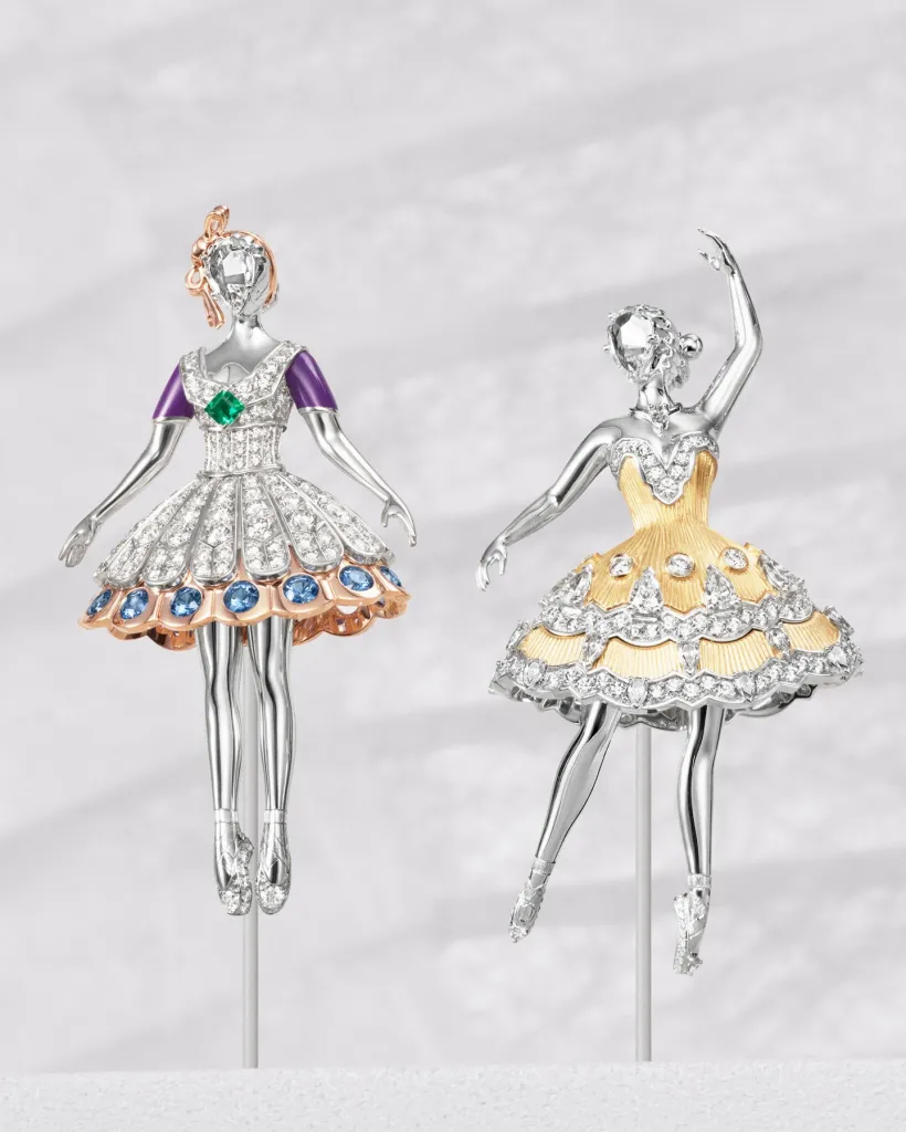 Elegant gold jewellery adorned with precious stones, theatrical and refined in design