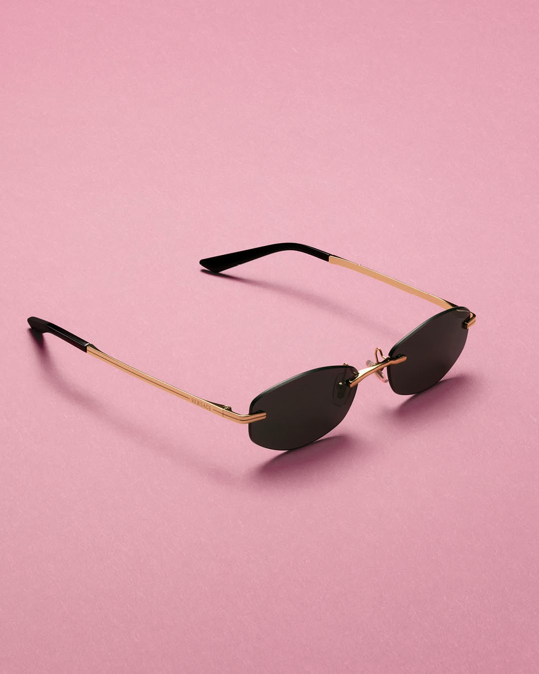 Close-up detail of Versace Fall Winter 2026 eyewear showcasing architectural design and premium materials