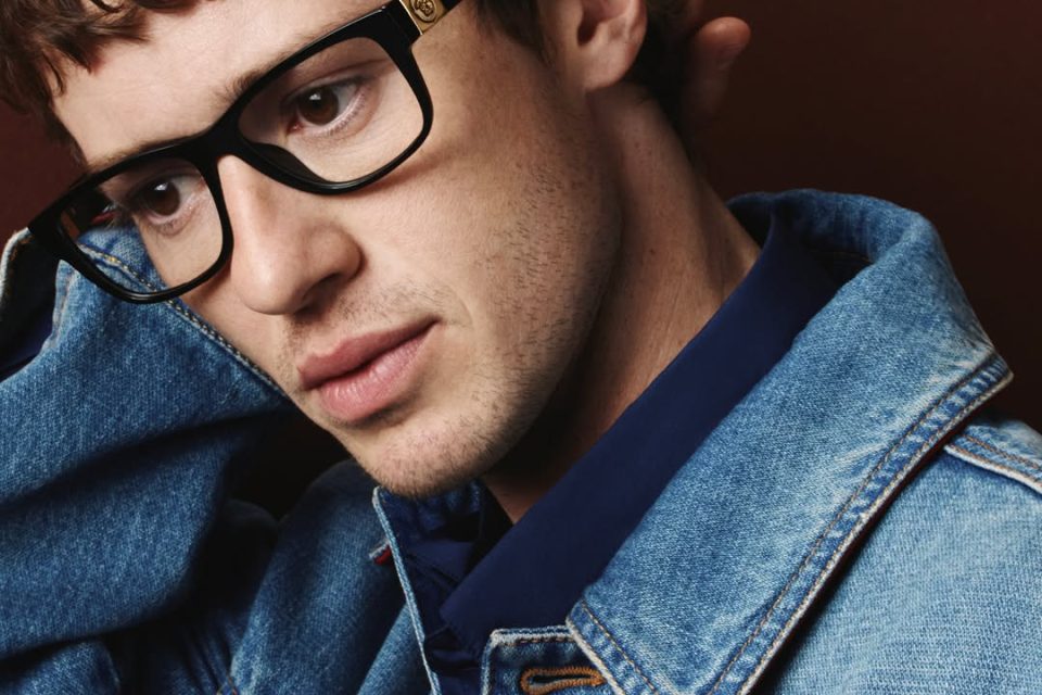 A model wearing Versace Fall Winter 2026 eyewear, captured in soft light with considered composition