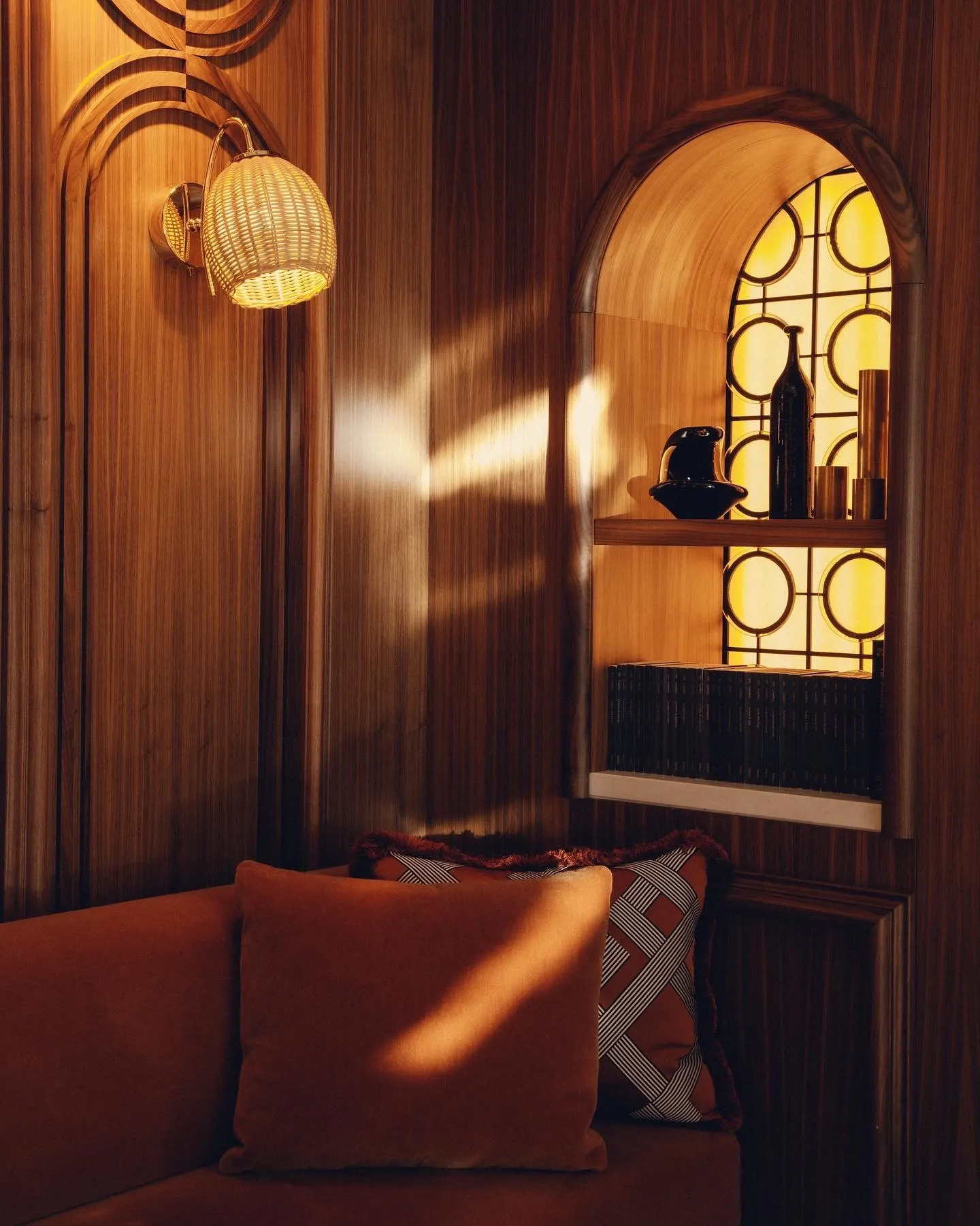 Richly textured autumn interior at W Hotels featuring warm burnished tones and layered soft furnishings
