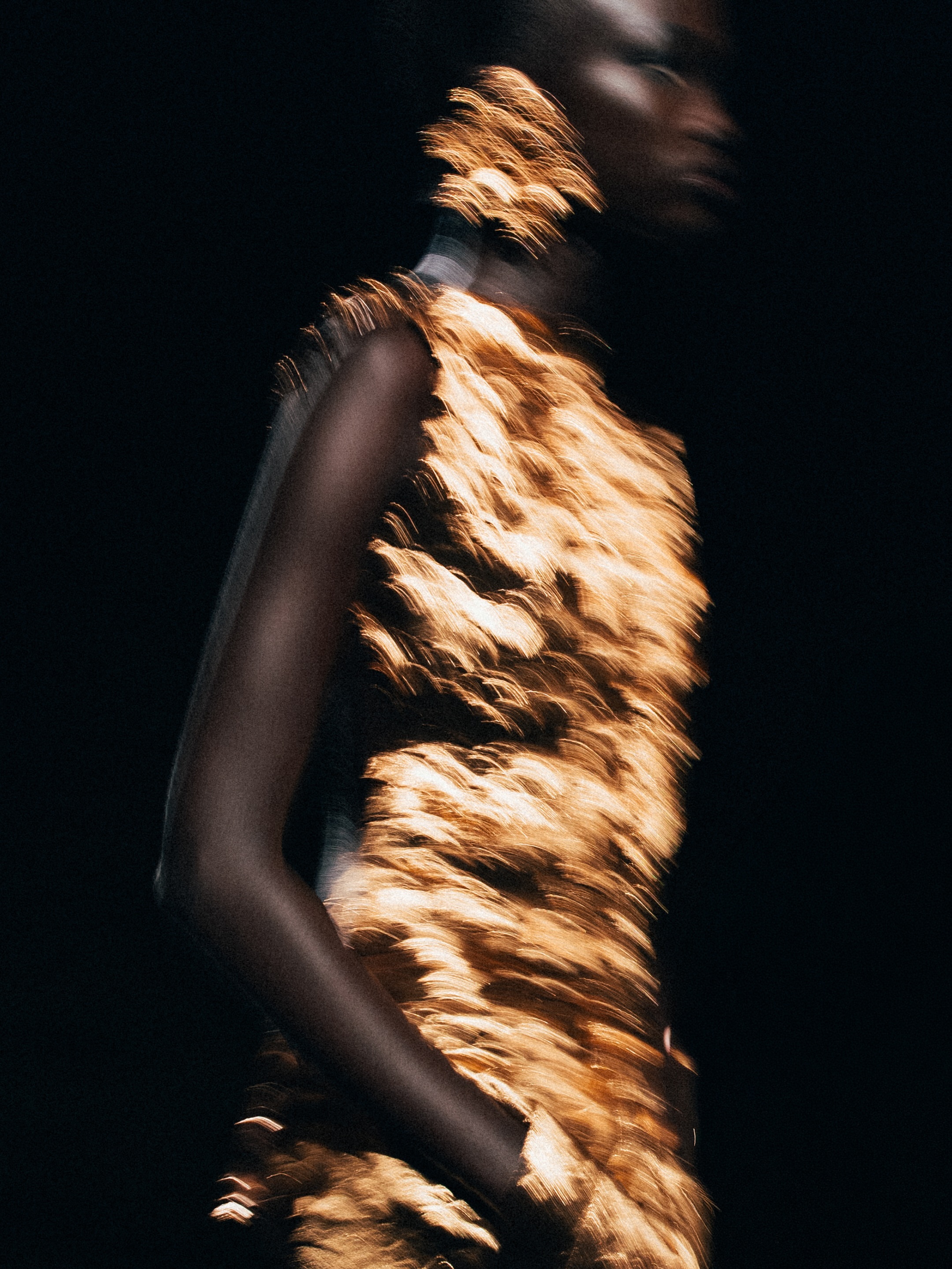 Soft neutral tones and fluid fabrics exemplifying Saint Laurent's approach to effortless sophistication