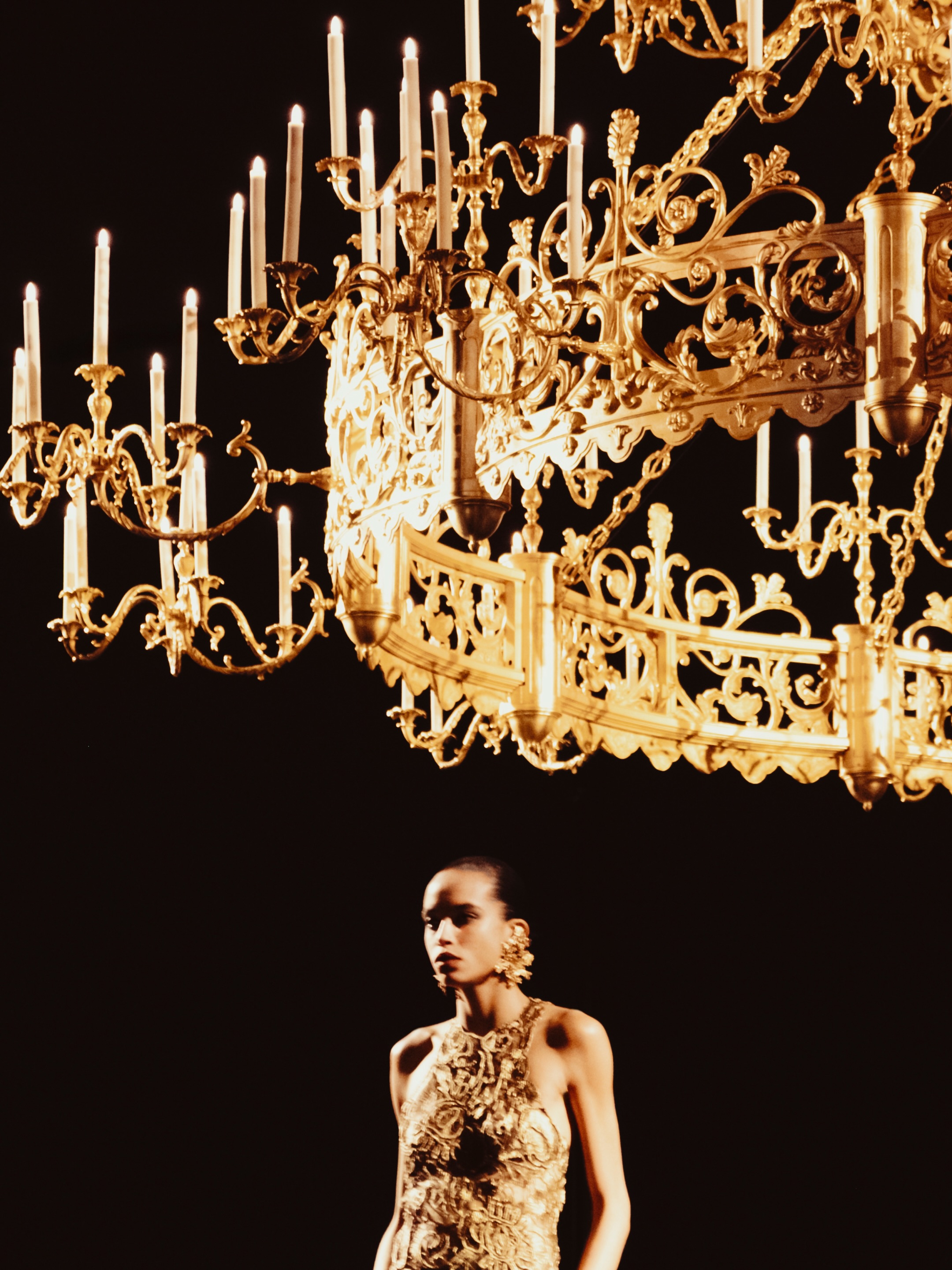 Model in summer-appropriate ensemble demonstrating the collection's commitment to wearable luxury