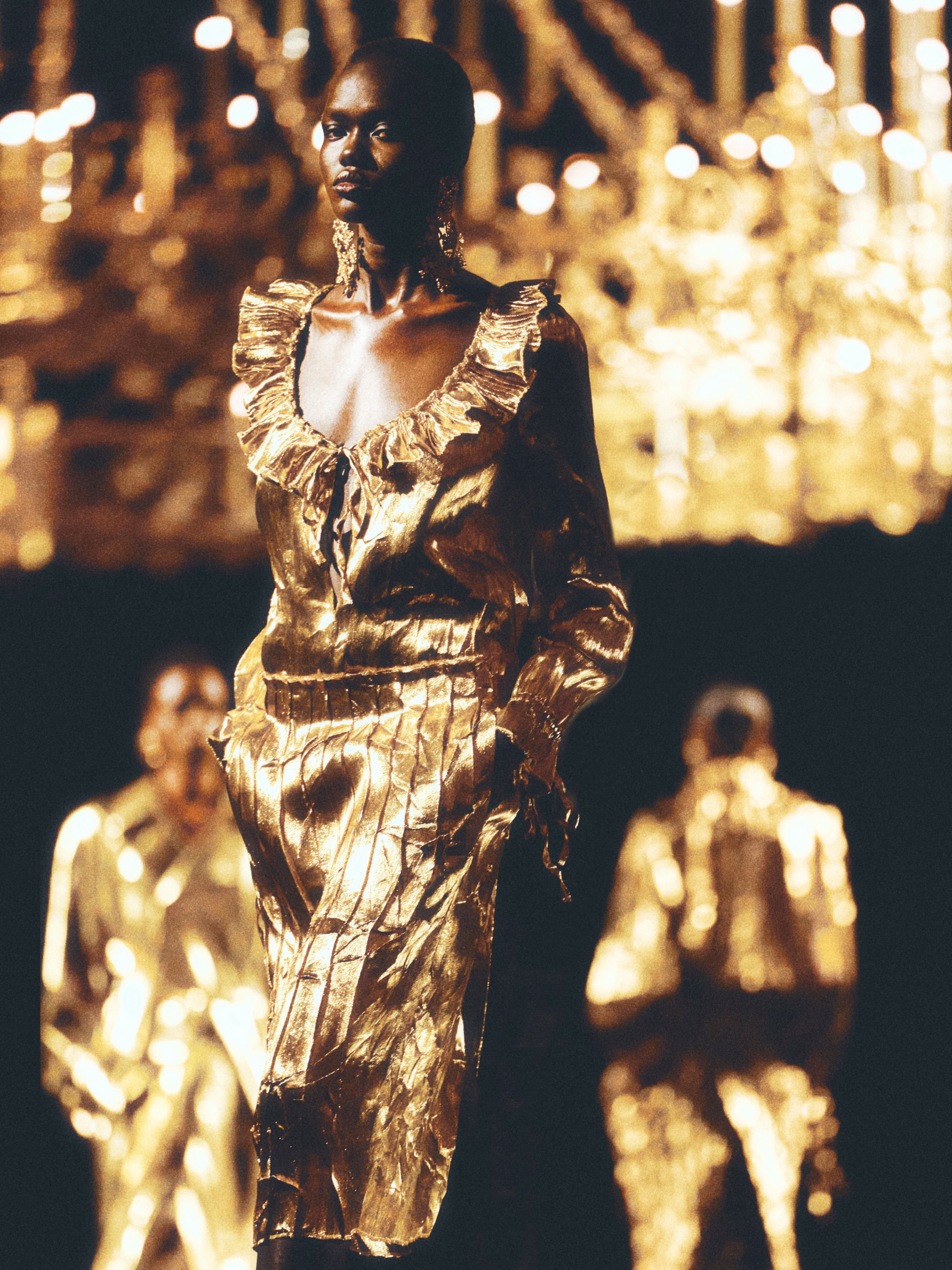 Model in flowing yet structured dress demonstrating the interplay between form and ease